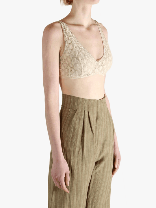 Tan bra worn by a person, showing the bra's fit