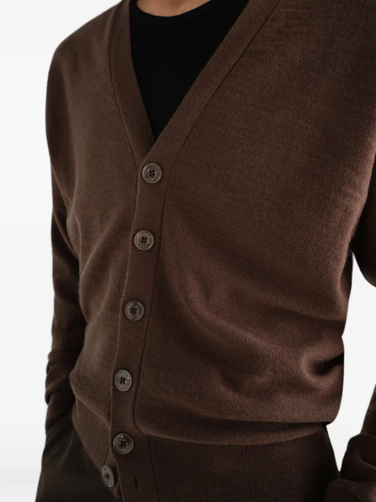 Brown knitwear worn by a person, showing the knitwear fit
