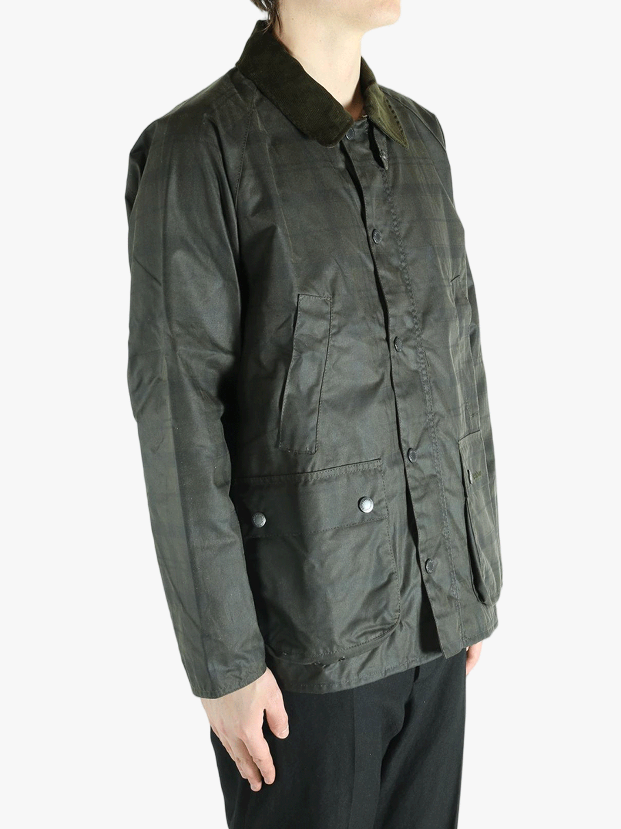 Green jacket worn by a person, showing the jacket's fit
