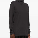 Black top worn by a person, showing the top fit