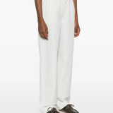 White pants worn by a person, showing the pants fit