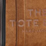 Close up of the brown flats, showing texture of the suede fabric