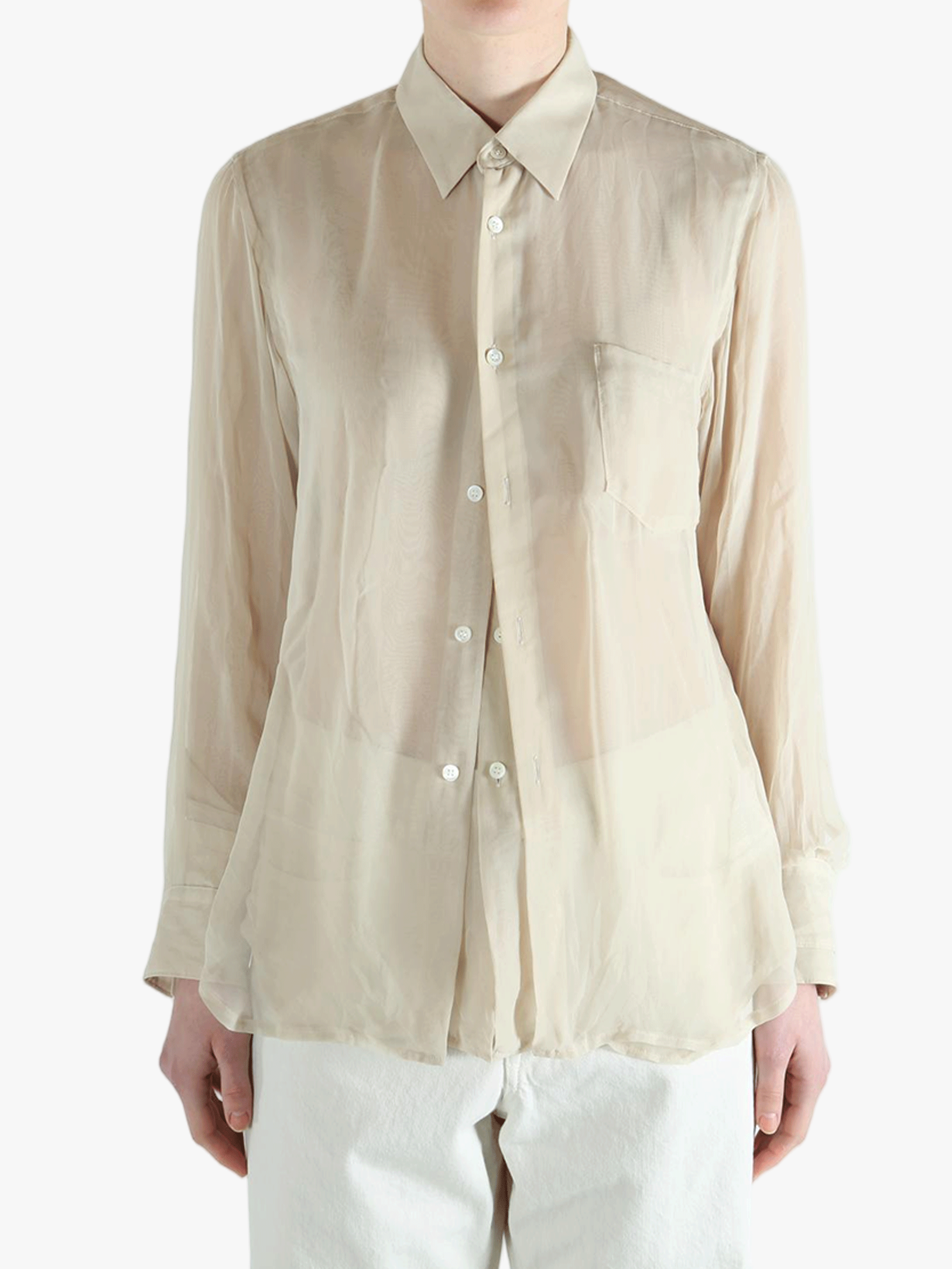 Tan shirt worn by a person, showing the shirt's fit