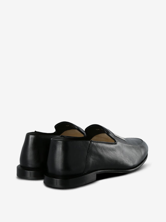 Black loafer, back view