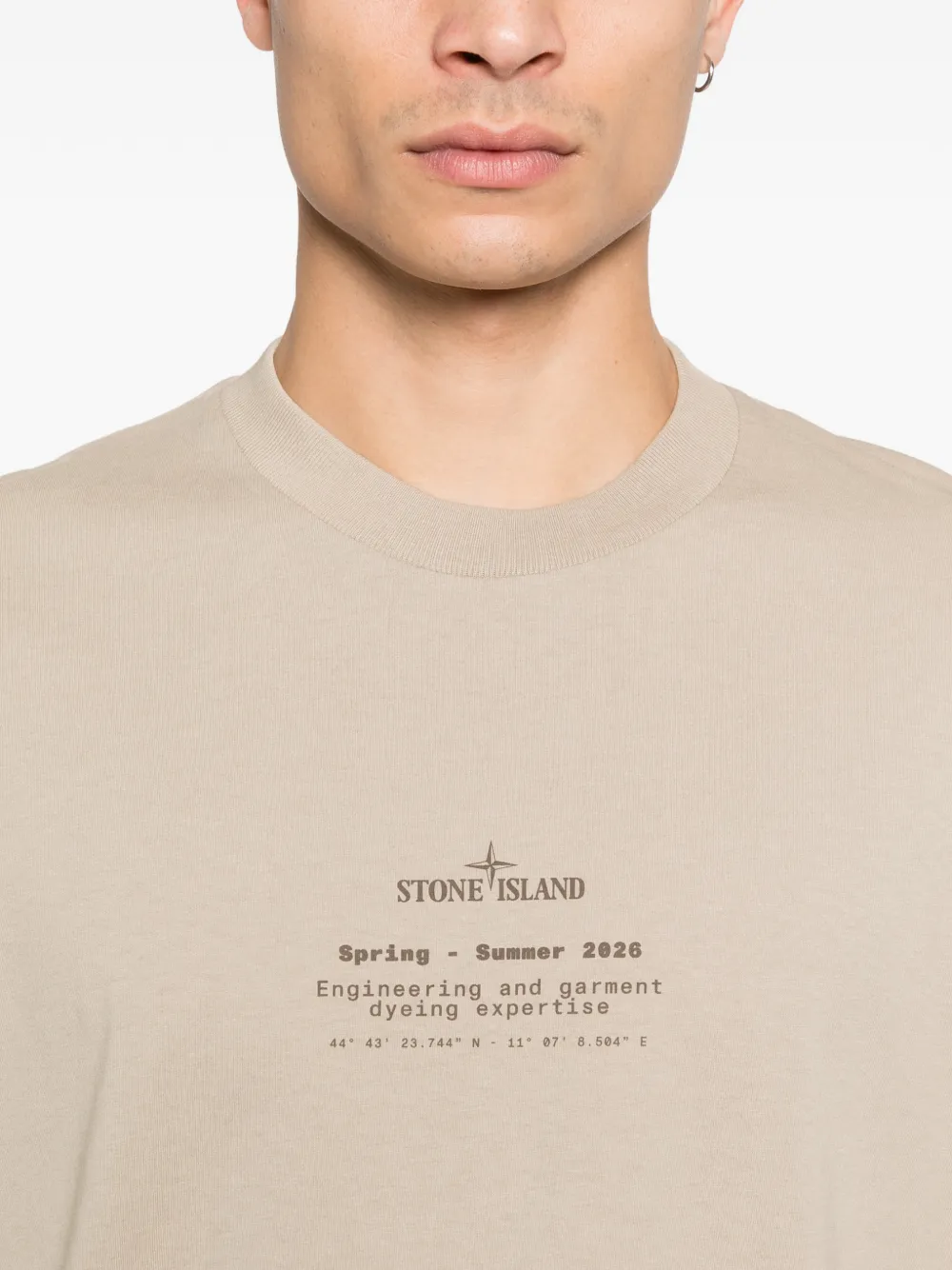 Close up of tan t-shirt, showing thetexture of the cotton fabric