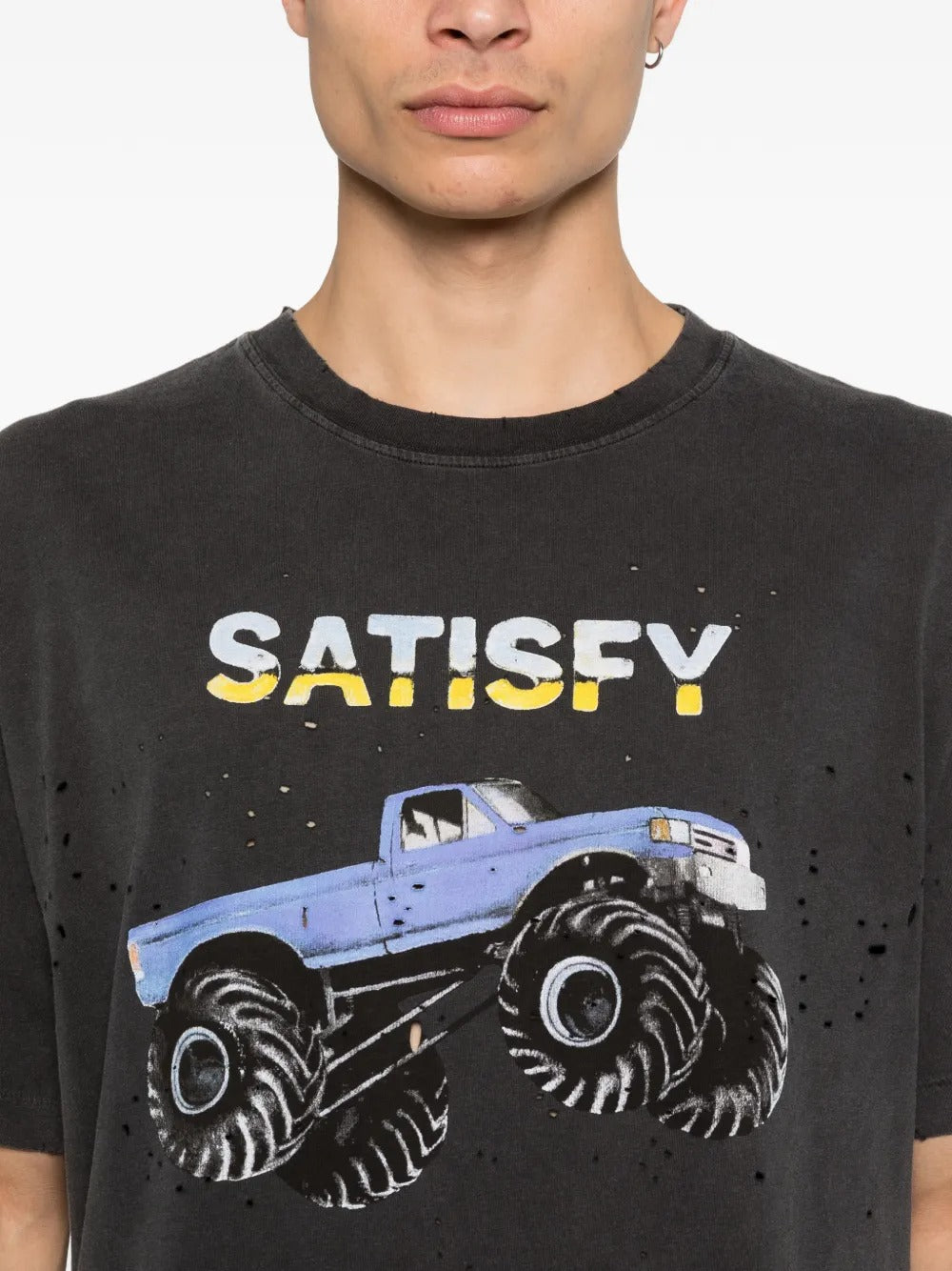 Close up of the black t-shrit, showing texture of the cotton fabric