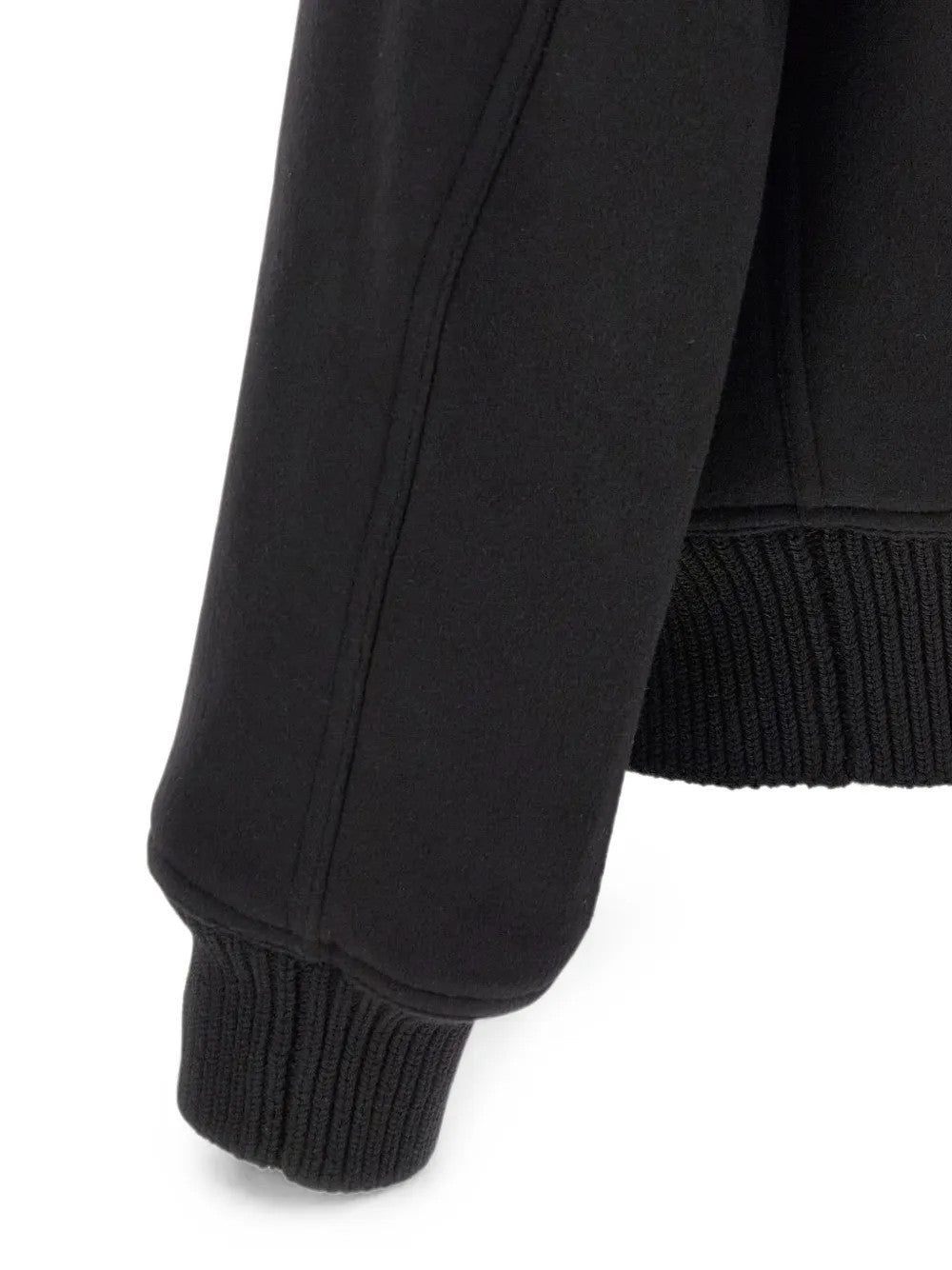 Close up of Black jacket, showing texture of the 100% wool fabric
