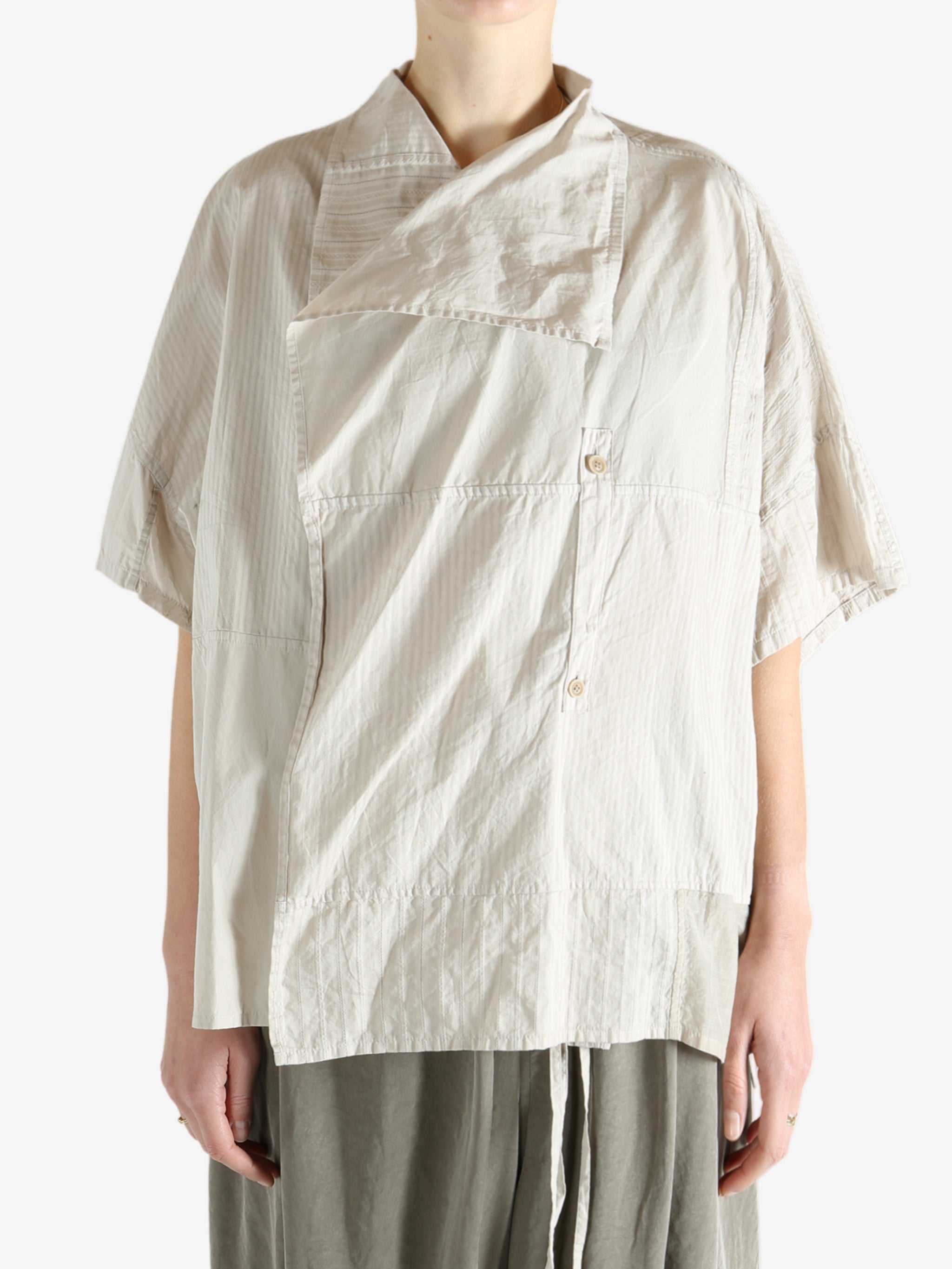 White shirts worn by a person, showing the shirts fit