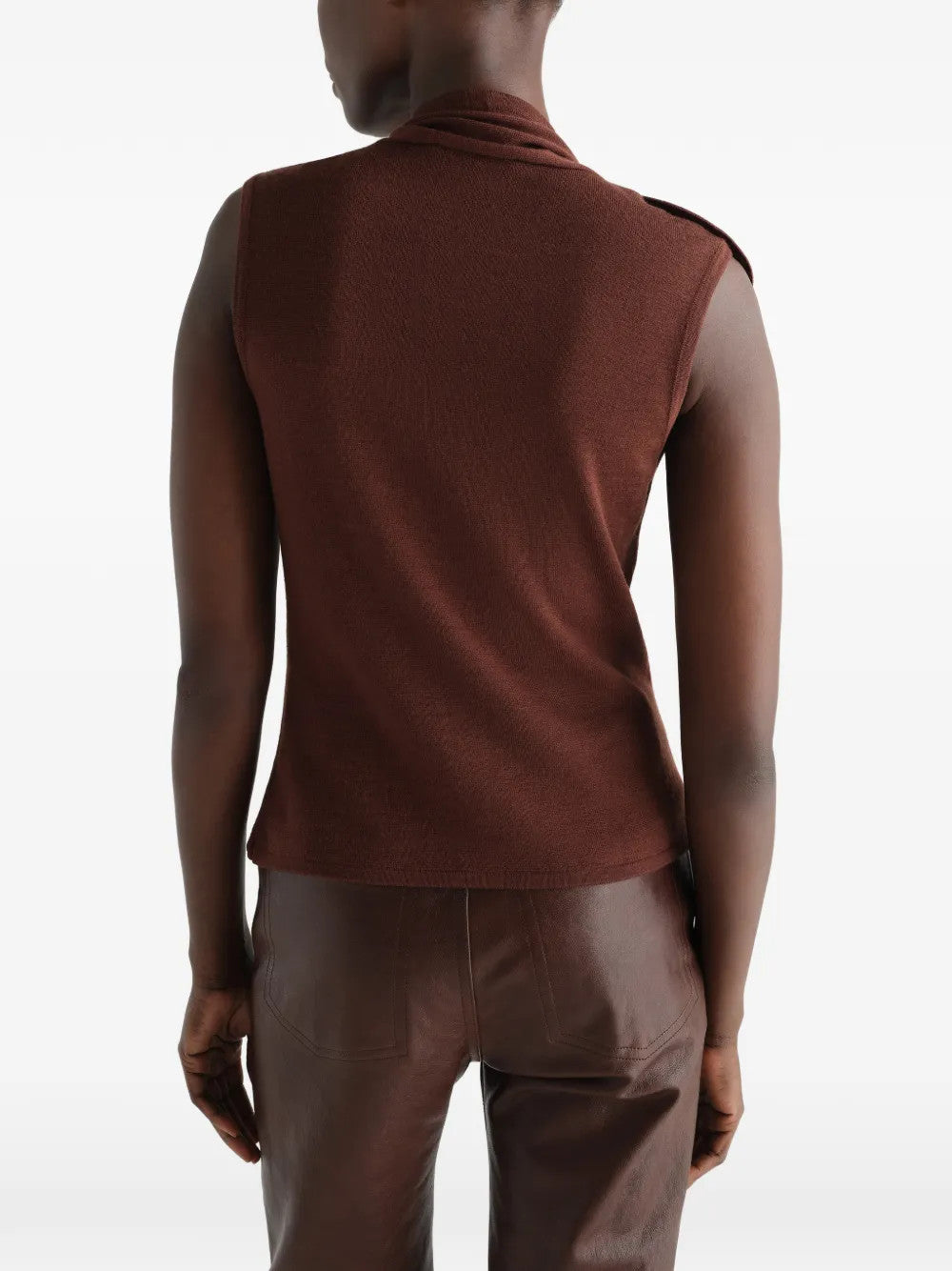 Brown top worn by a person, showing the top fit