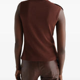 Brown top worn by a person, showing the top fit