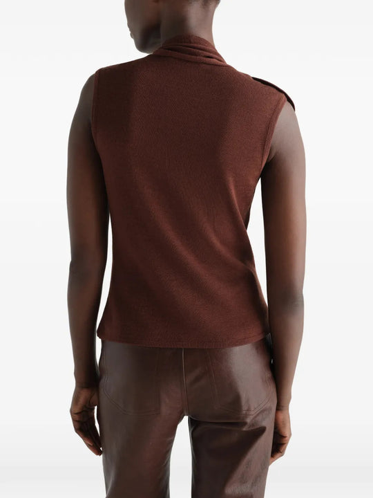 Brown top worn by a person, showing the top fit