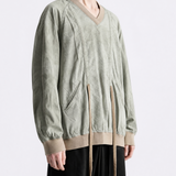 Green shirt worn by a person, showing the shirt fit