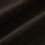 Close up of brown pants, showing texture of the cotton fabric