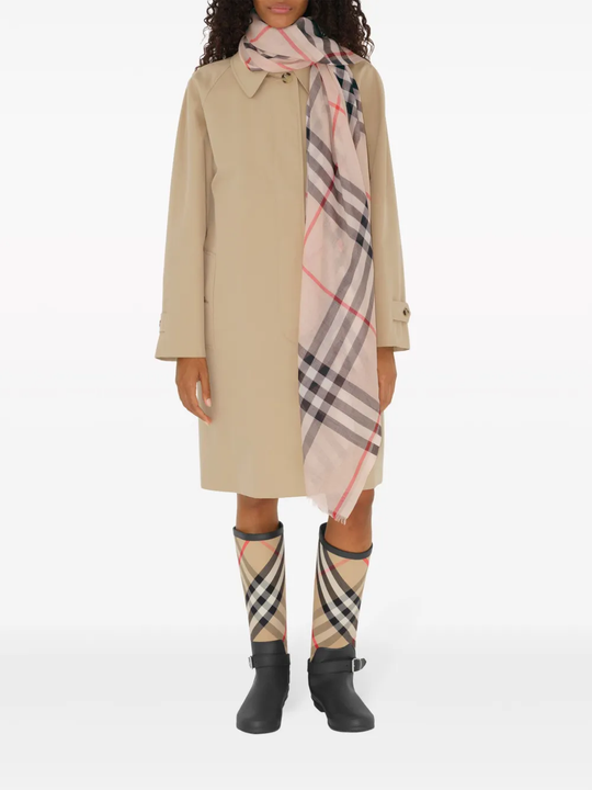 Tan scarf worn by a person, showing the scarf fit