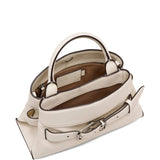 Close up of the white bag, showing texture of the leather fabric