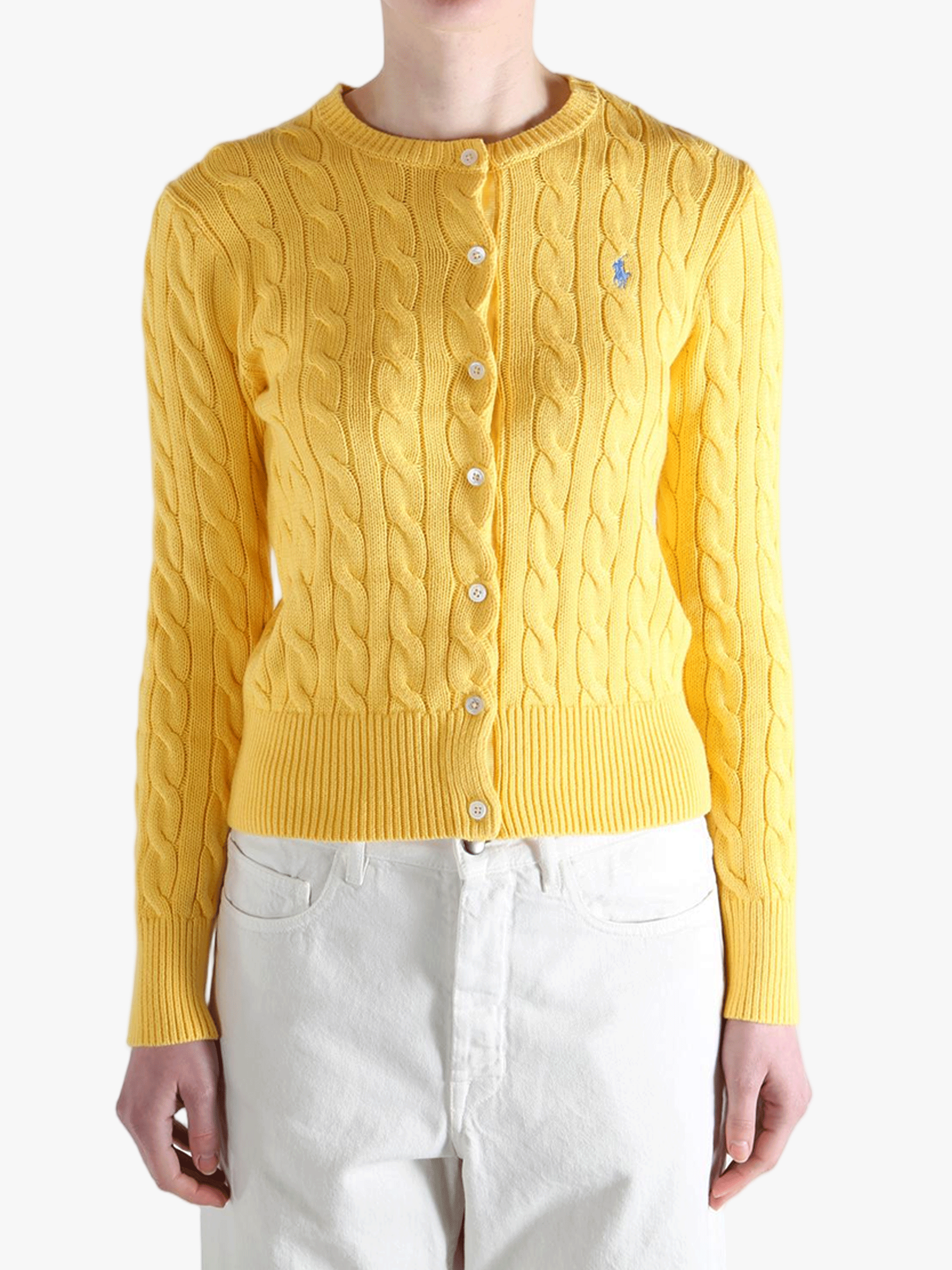 Yellow knitwear worn by a person, showing the  knitwear's fit