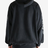 Black hoodie worn by a person, showing the hoodie's fit