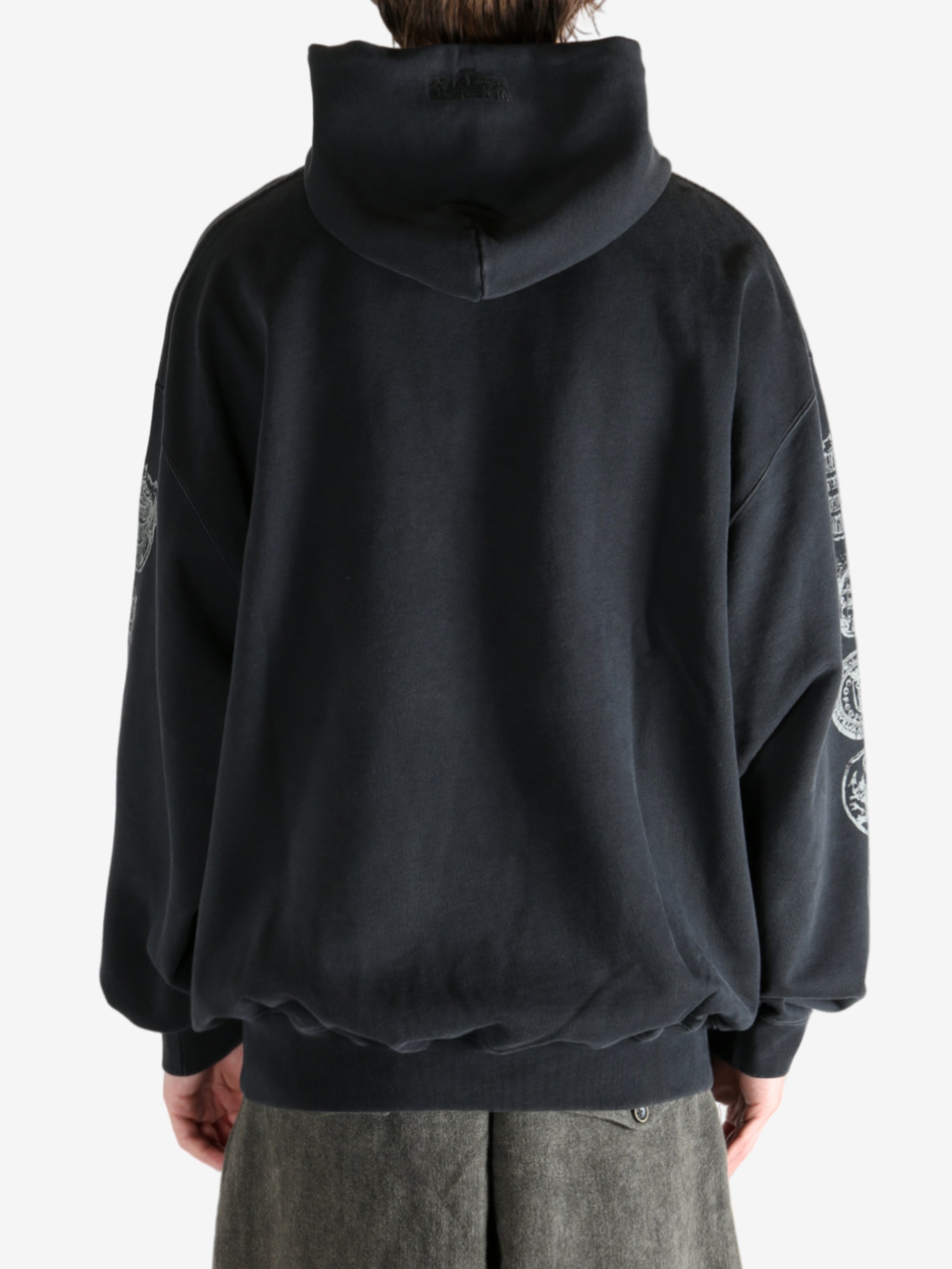 Black hoodie worn by a person, showing the hoodie's fit