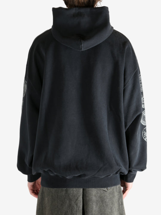 Black hoodie worn by a person, showing the hoodie's fit