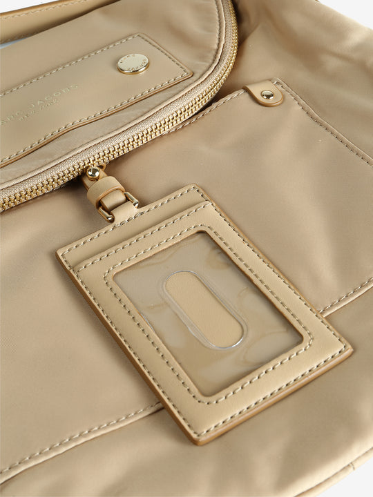 Close up of tan bags, showing texture of the nylon fabric
