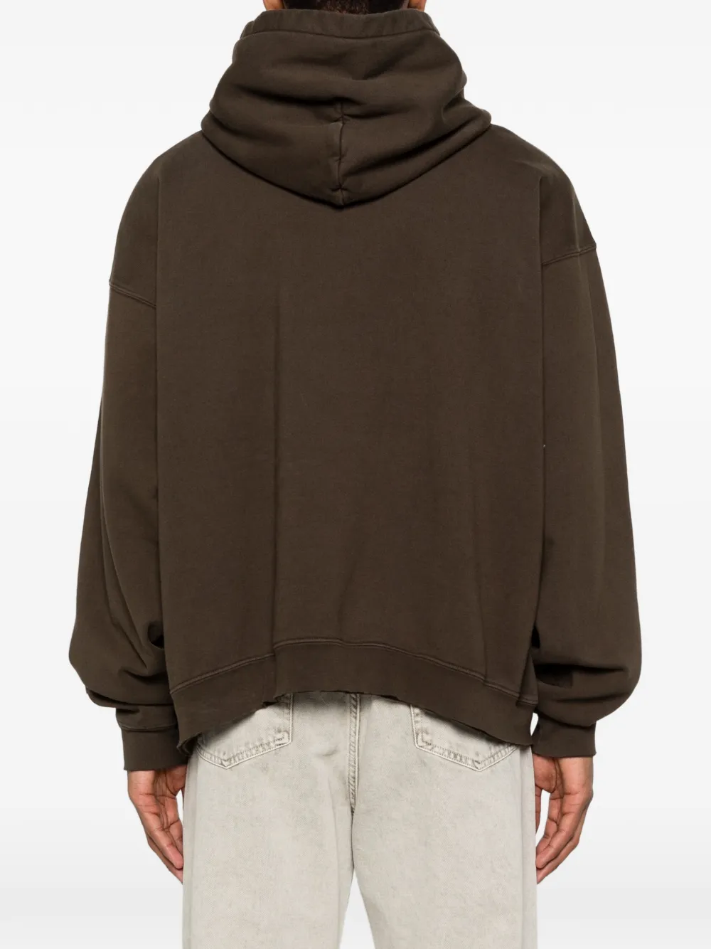 Brown hoodies worn by a person, showing the hoodies fit