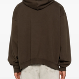 Brown hoodies worn by a person, showing the hoodies fit