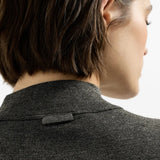 Grey knitwear worn by a person, showing the knitwear fit