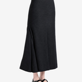 Black skirt worn by a person, showing the skirt fit
