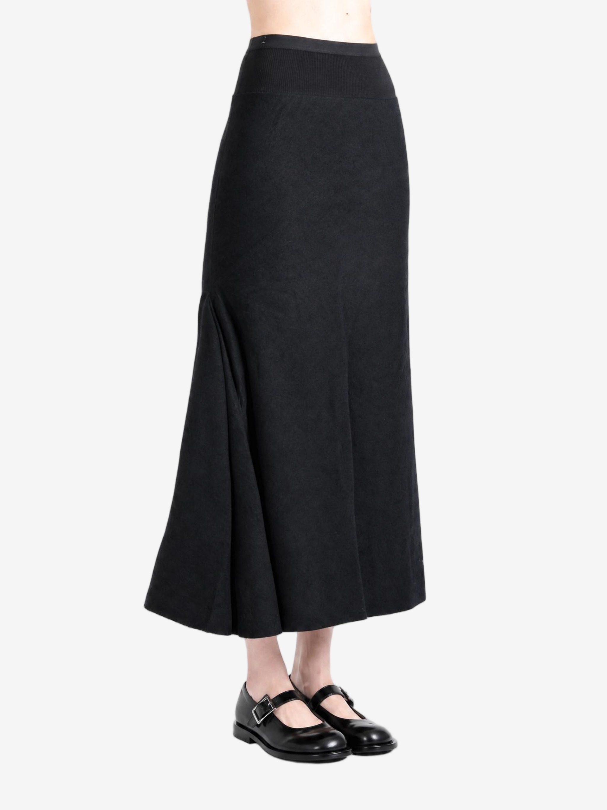 Black skirt worn by a person, showing the skirt fit