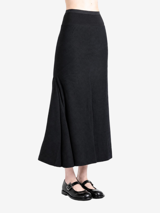 Black skirt worn by a person, showing the skirt fit