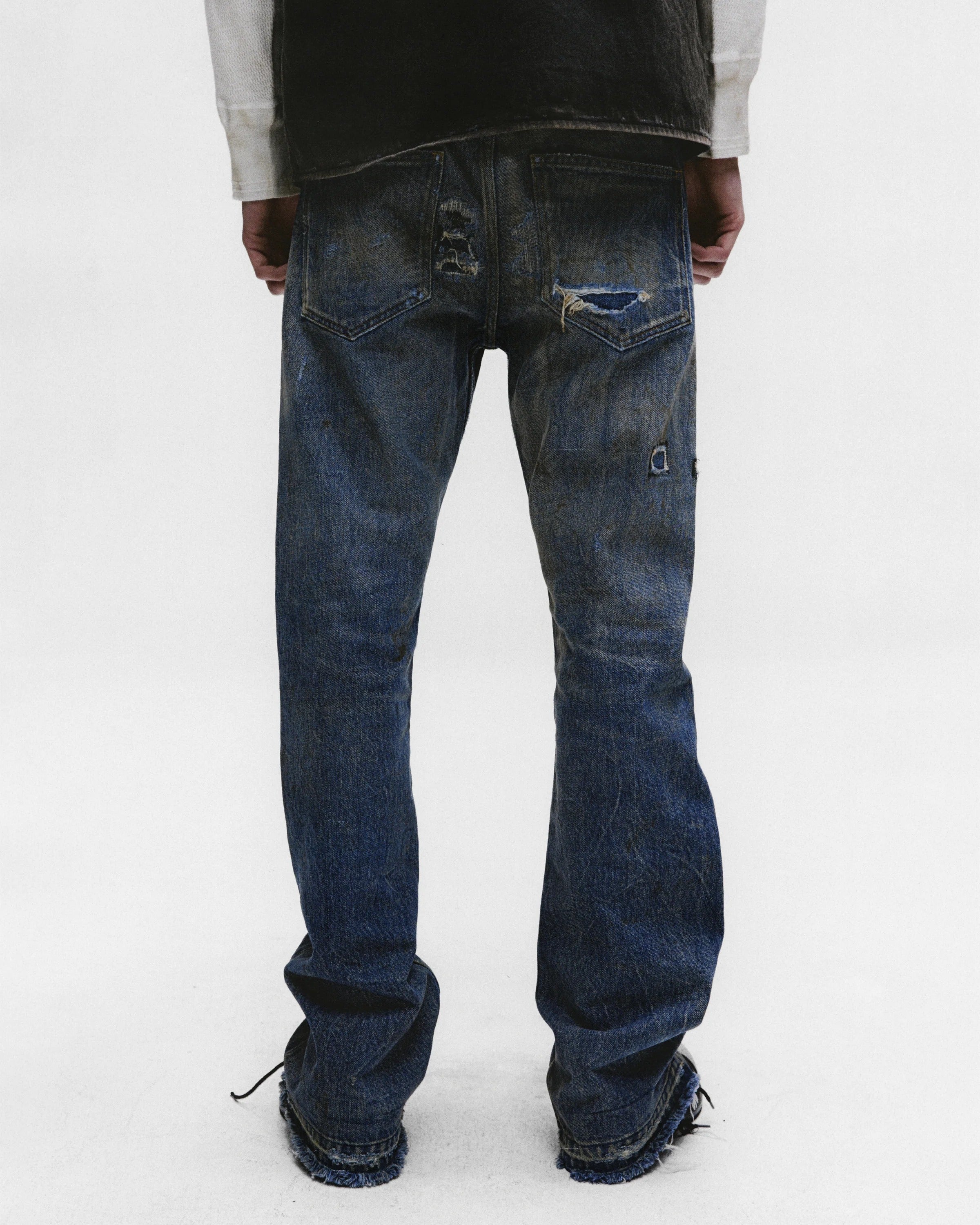 Blue pants worn by a person, showing the pants fit