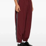 Burgundy pants, full body view