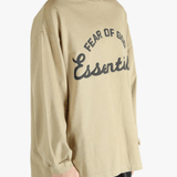 Tan t-shirt worn by a person, showing the t-shirt's fit
