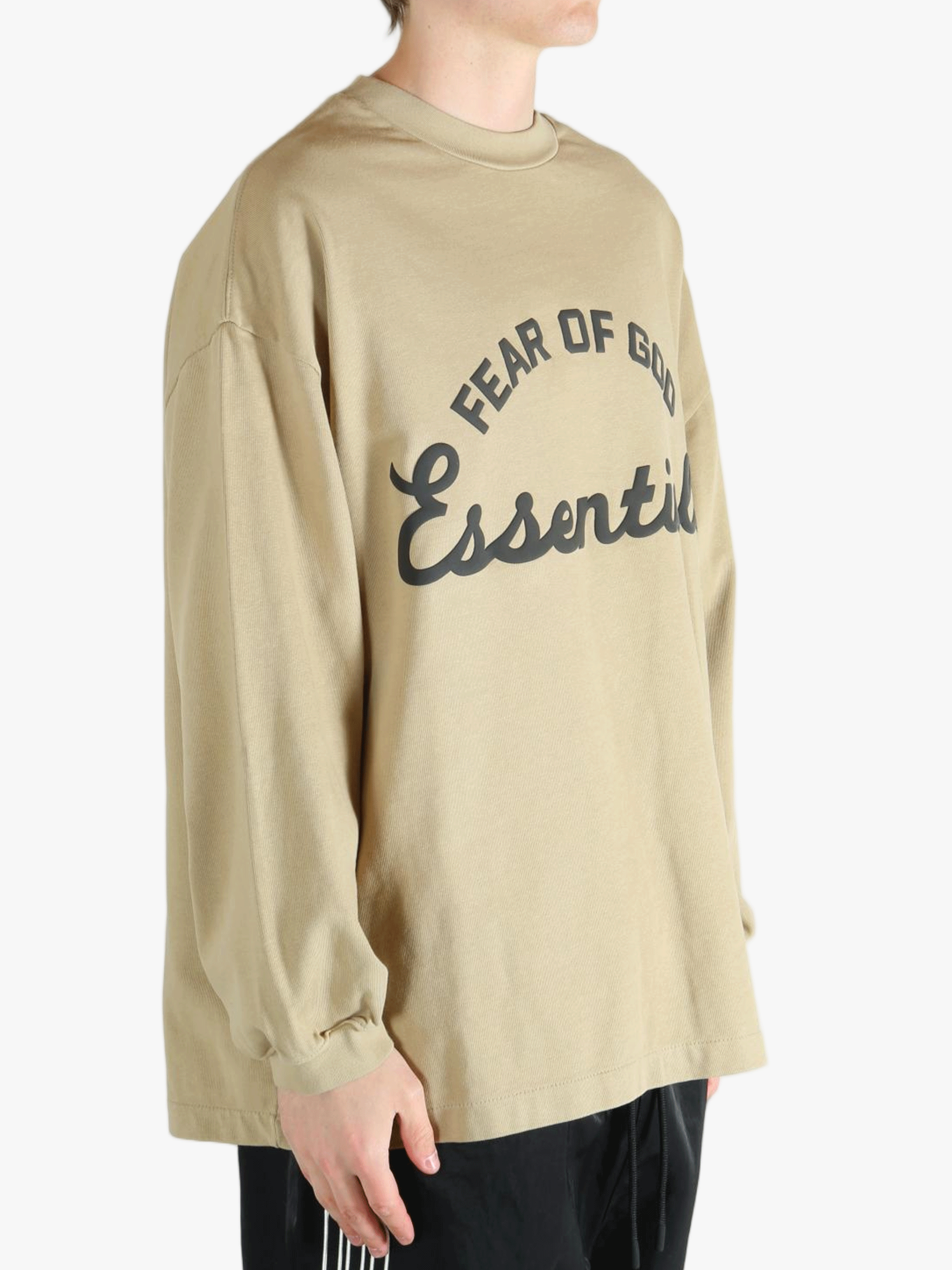 Tan t-shirt worn by a person, showing the t-shirt's fit