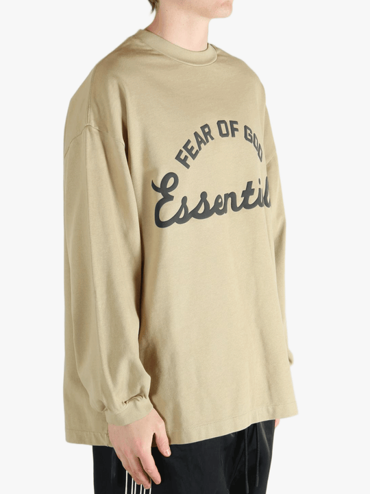 Tan t-shirt worn by a person, showing the t-shirt's fit