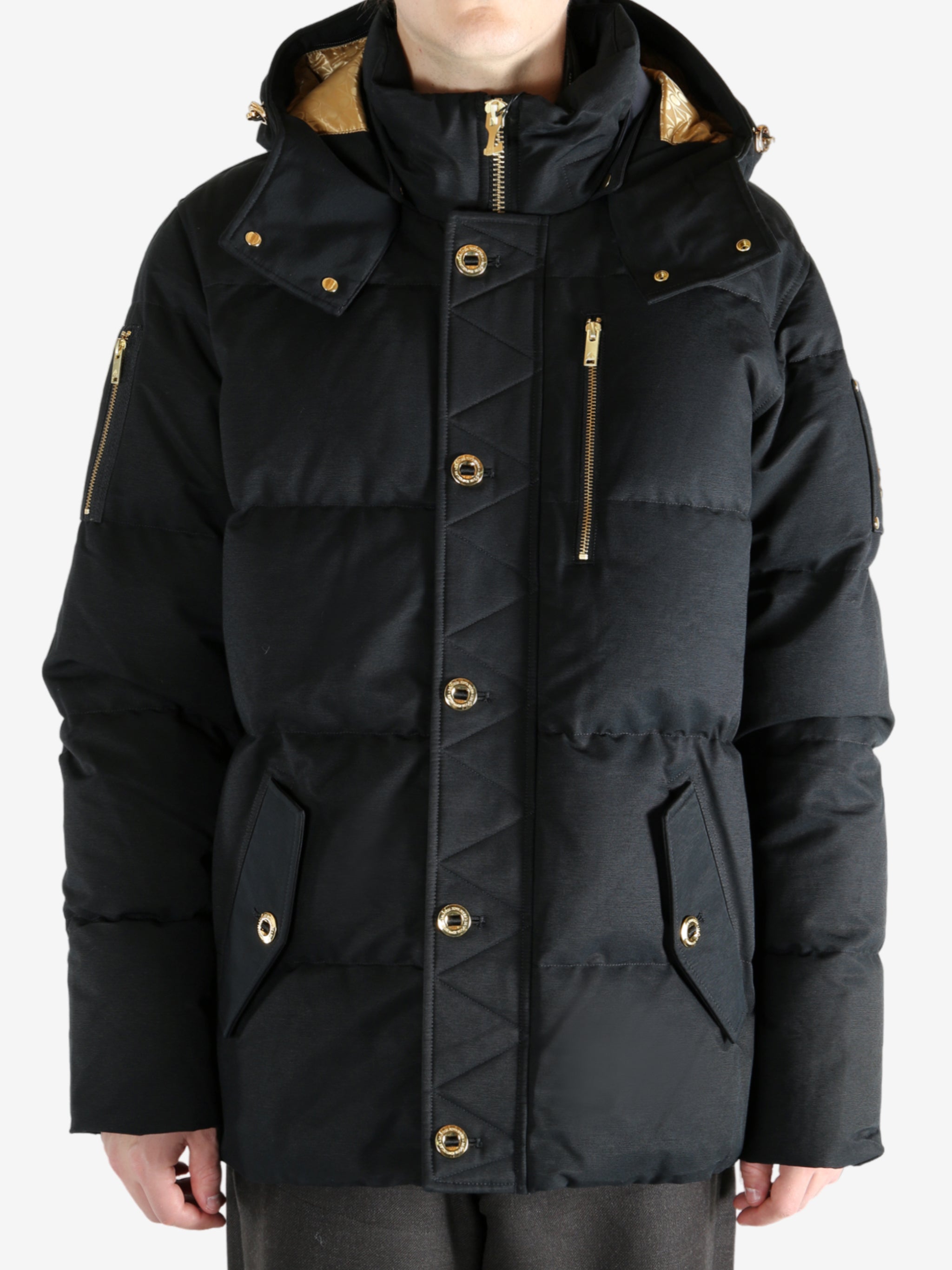 Black jacket worn by a person, showing the jacket's fit