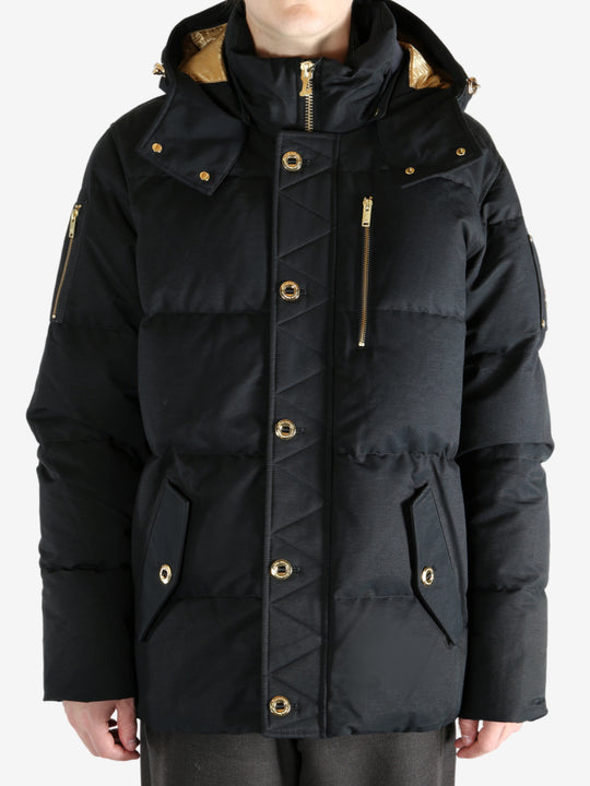Black jacket worn by a person, showing the jacket's fit