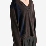 Brown sweater worn by a person, showing the sweater's fit