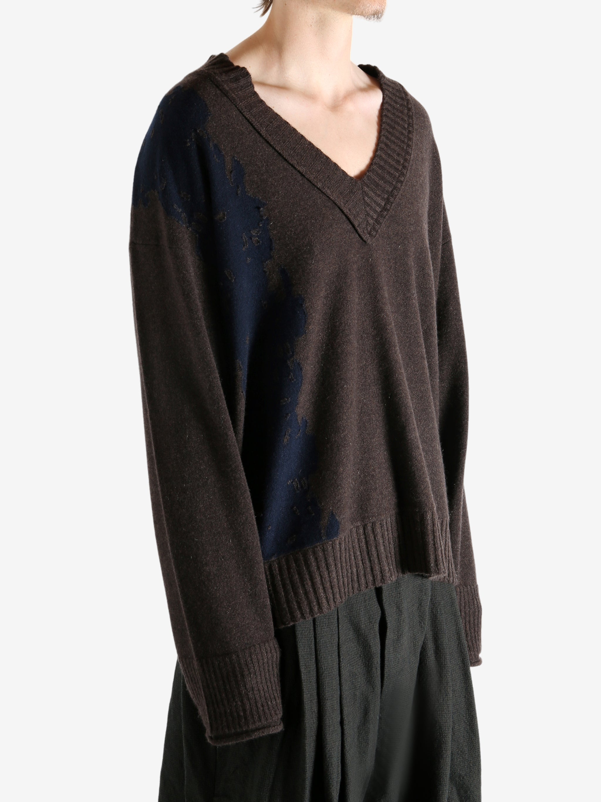 Brown sweater worn by a person, showing the sweater's fit