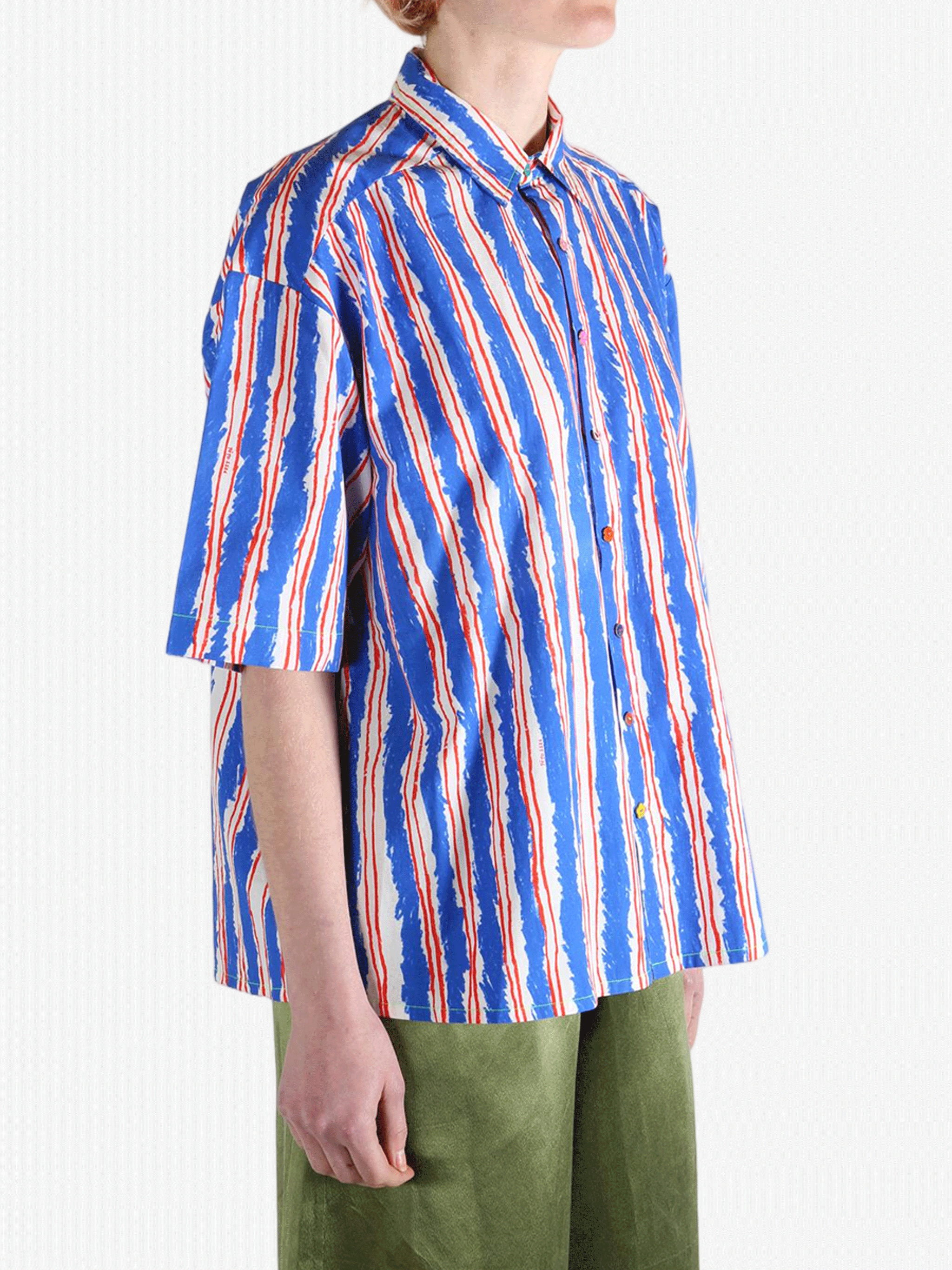 Blue shirts worn by a person, showin the shirt's fit