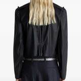 Black tops worn by a person, showing the tops fit