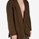 Brown jacket worn by a person, showing the jacket's fit