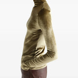 Green top worn by a person, showing the top fit