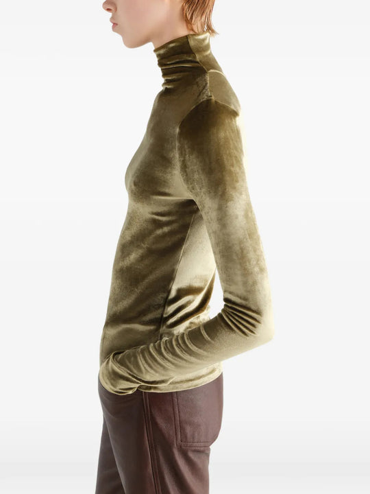 Green top worn by a person, showing the top fit