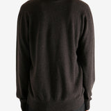 Brown sweater worn by a person, showing the sweater's fit