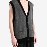 Grey knitwear worn by a person, showing the knitwear fit