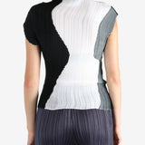 White shirt worn by a person, showing the shirt's fit