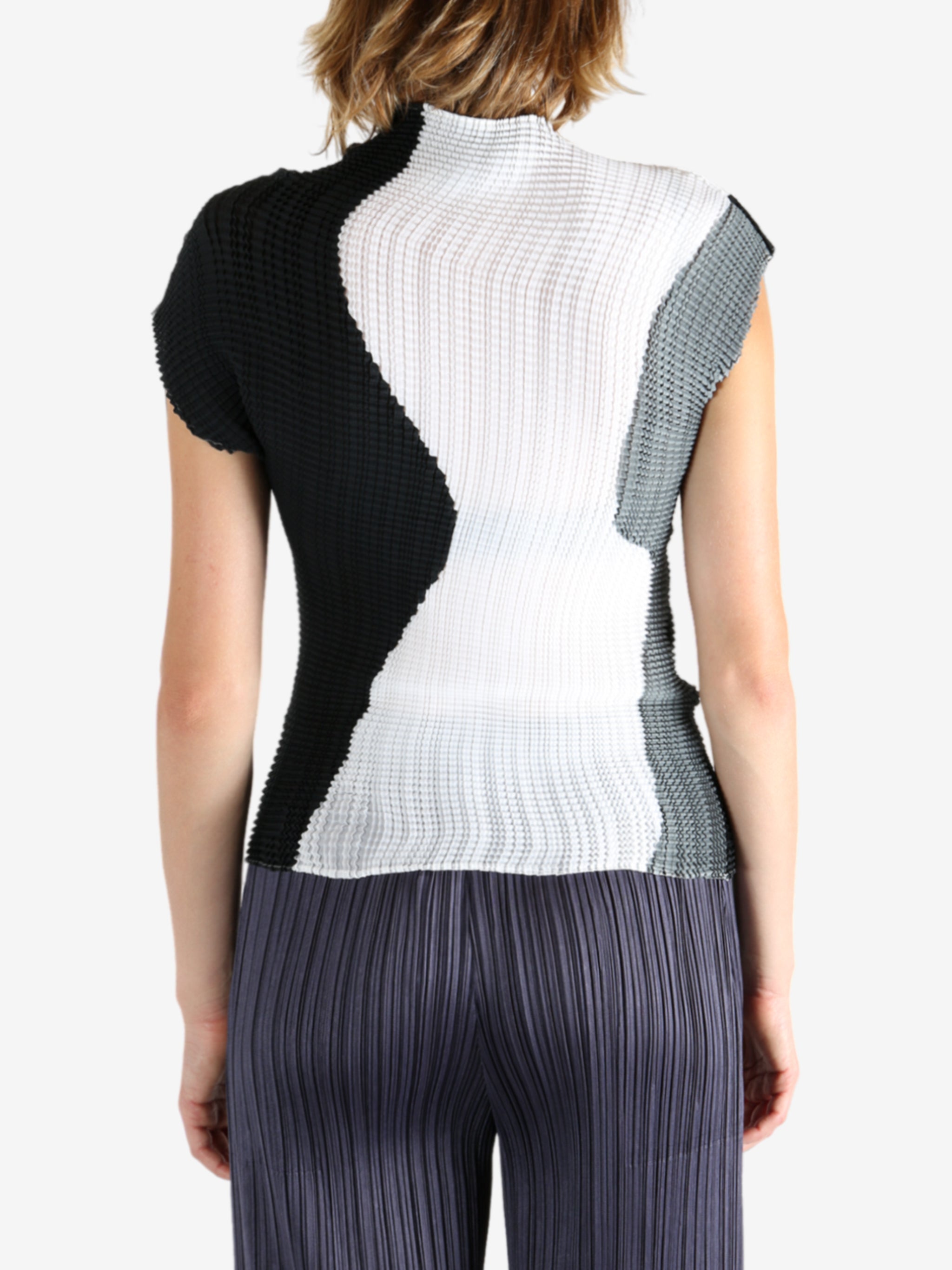 White shirt worn by a person, showing the shirt's fit