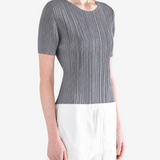 Grey shirt worn by a person, showing the shirt fit