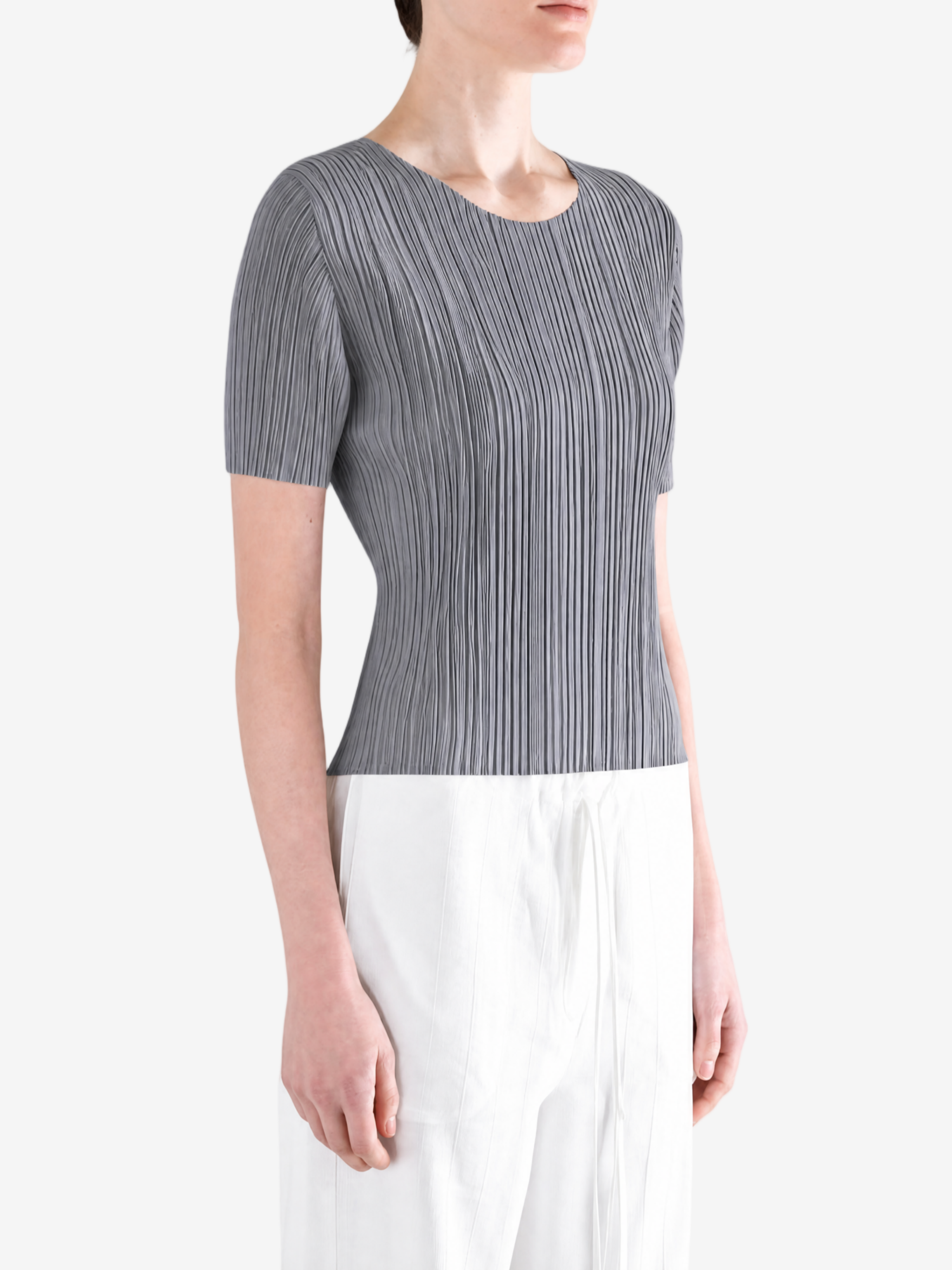 Grey shirt worn by a person, showing the shirt fit